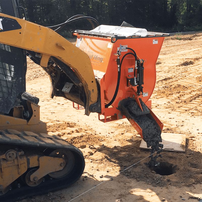 Cat skid steer with the concrete mixer in action from EZG manufacturing. 