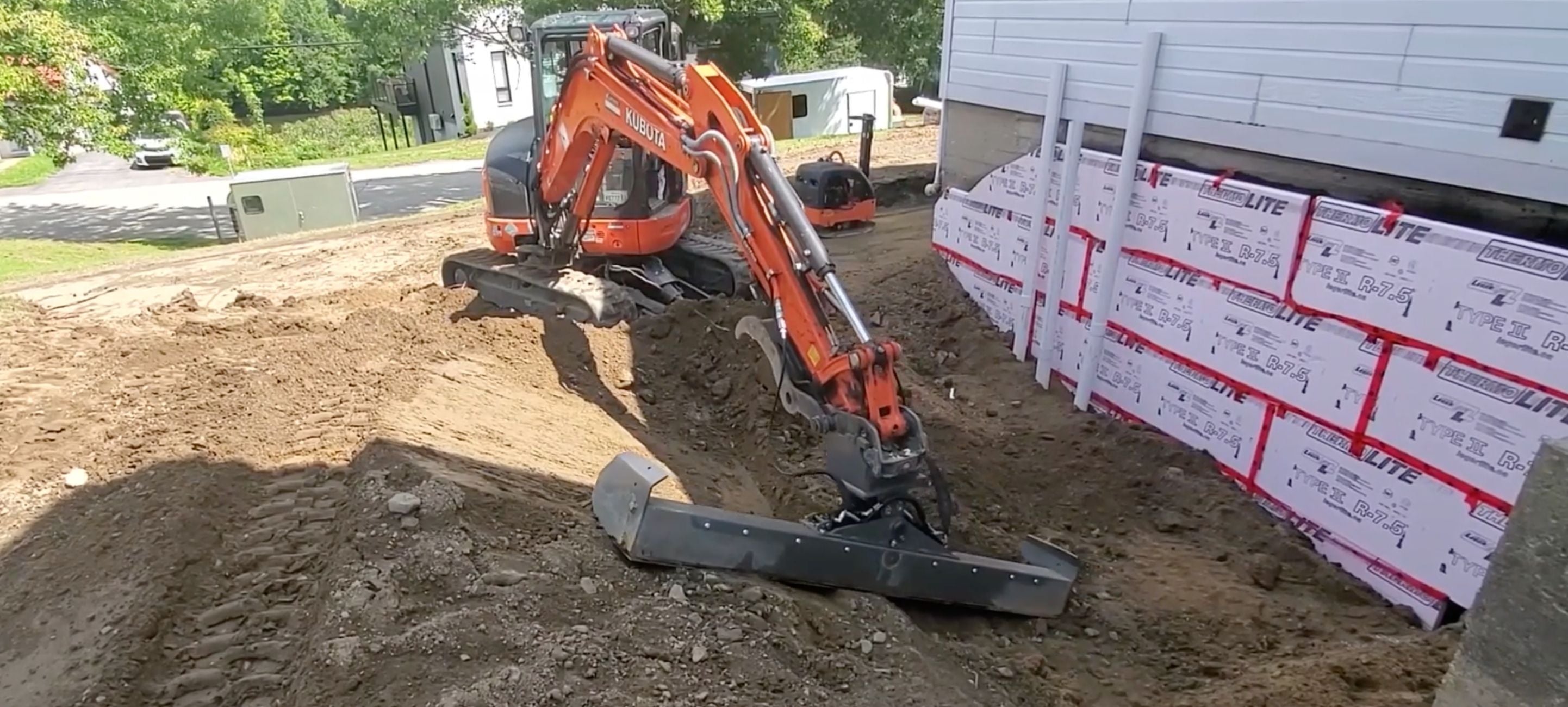 Skeer system exbeam grading beam on a kubota excavator doing its thing