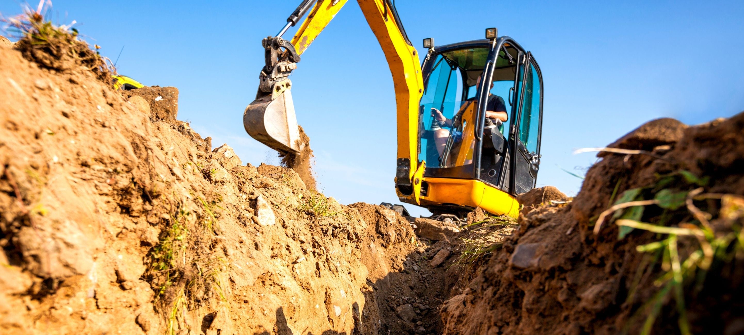 Excavating dirt with the Blue Diamond excavator bucket attachments