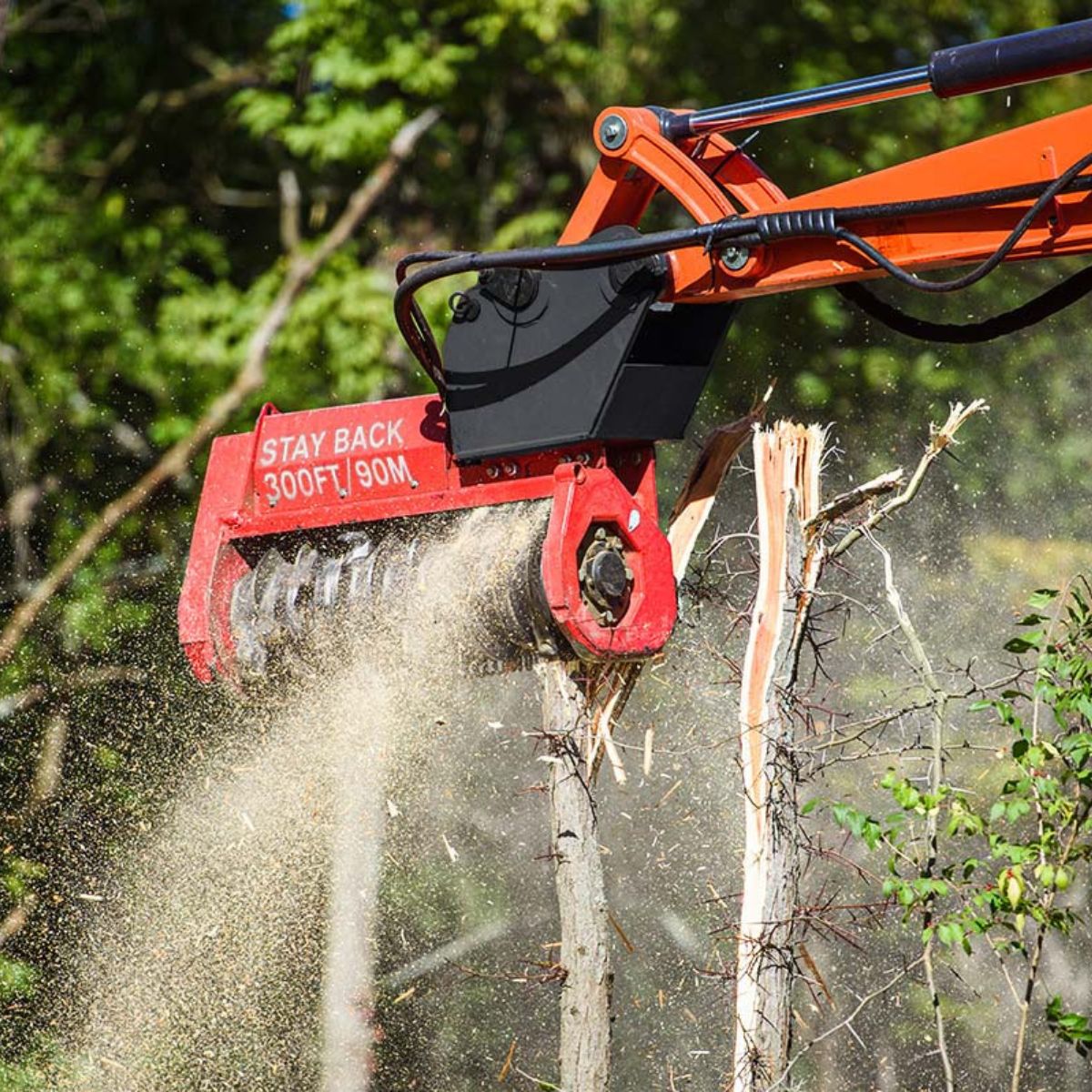 excavator-with-the-fecon-forestry-mulcher-attachment-grinding-trees-in-the-forest