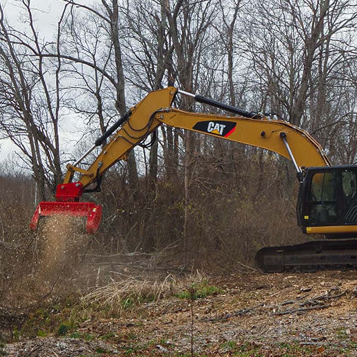 mulching-trees-in-the-forest-with-the-large-excavator-using-the-fecon-mulcher-attachment