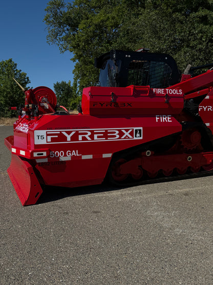 Side view of a red FYREBX T5 500-gallon firefighting attachment mounted on a track loader outdoors