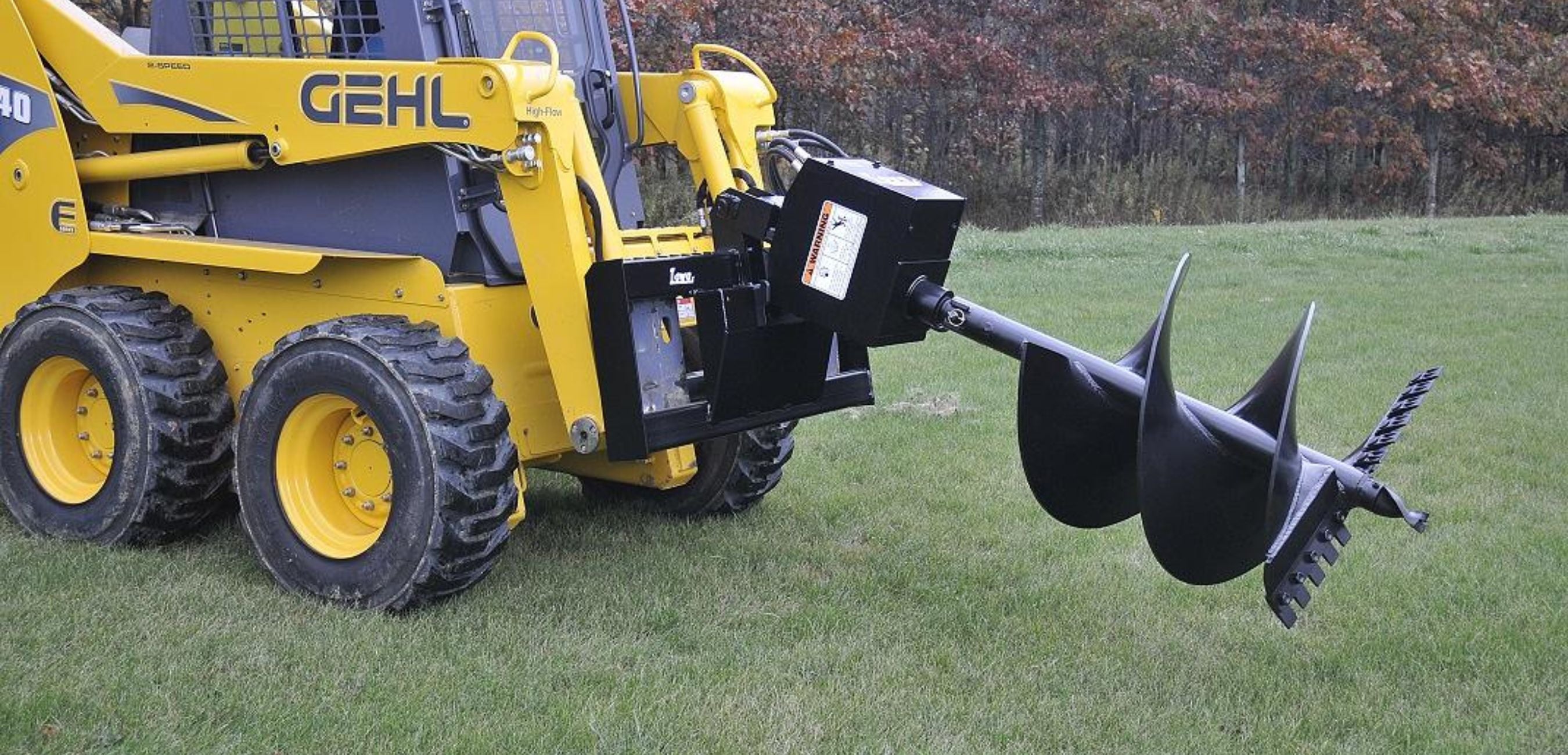 gehl-skid-steer-with-lowe-auger-attachment