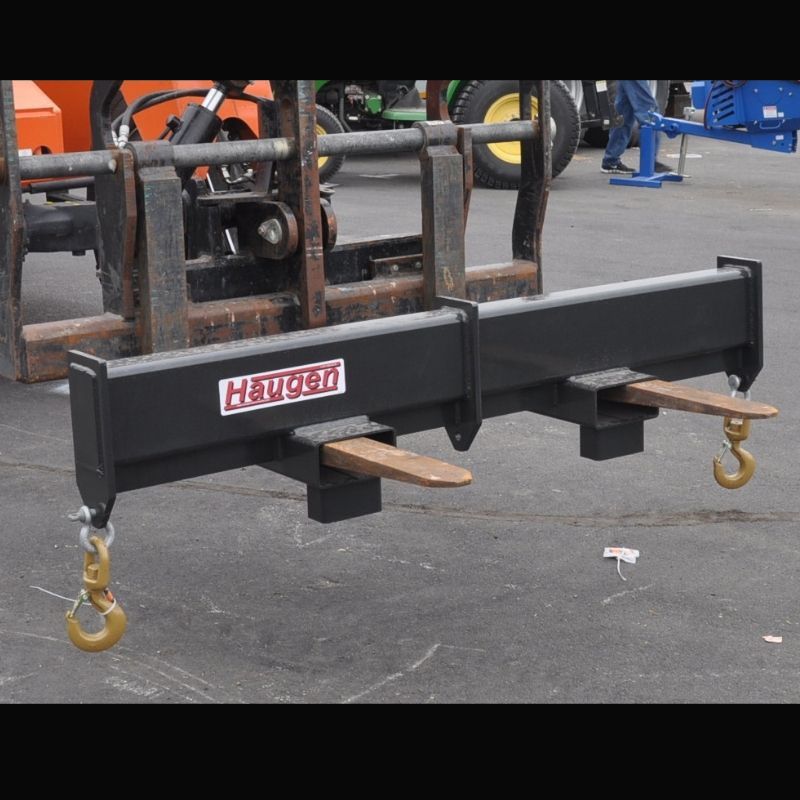 Fork mounted rigid spreader bar attachment from Haugen. 