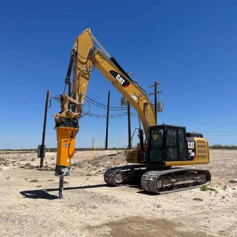 cat-excavator-with-montana-breaker-attachment-in-action