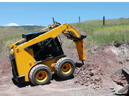 montana-breaker-mounted-on-skid-steer-breaking-dirt