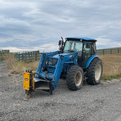 farm tractor with post driver