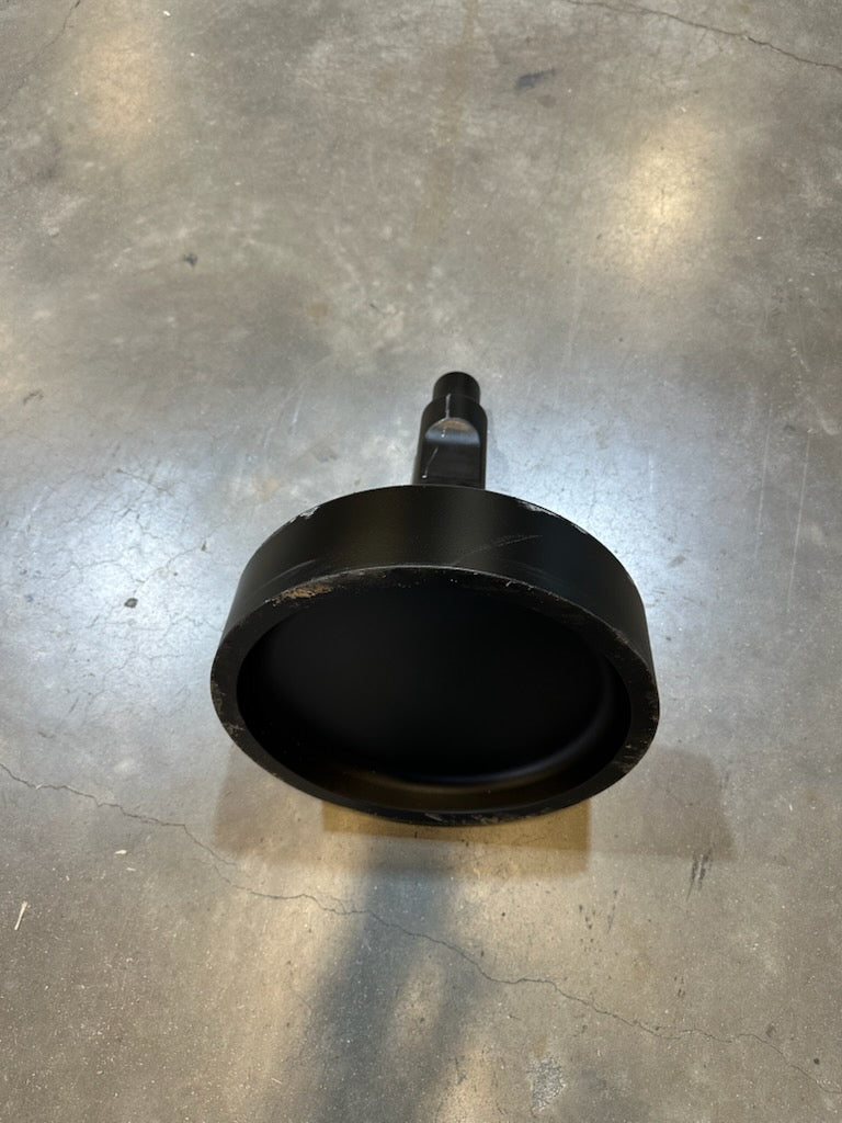 Black metal attachment with a deep circular base and center shaft