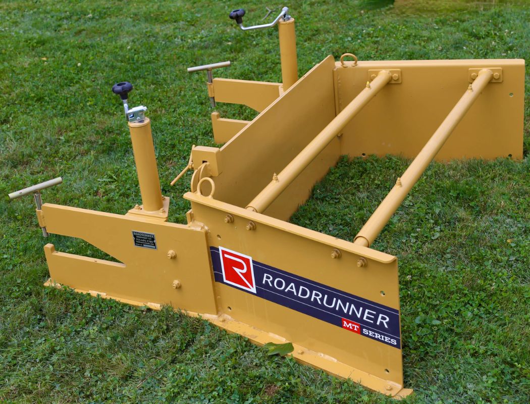 Roadrunner MT Series skid steer paver attachment shown on grass in a side view