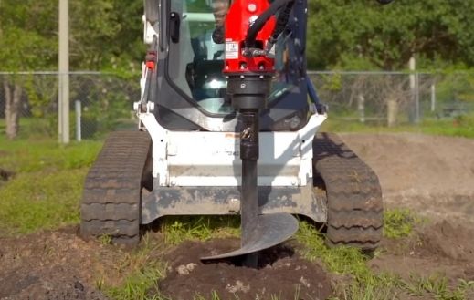 Bobcat skid steer with the Auger attachment from McLaren industries