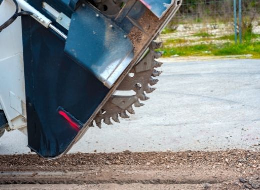 Concrete saw attachment for skid steer cutting concrete