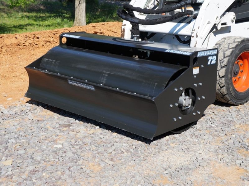 Blue Diamond vibratory roller attachment on a bobcat skid steer