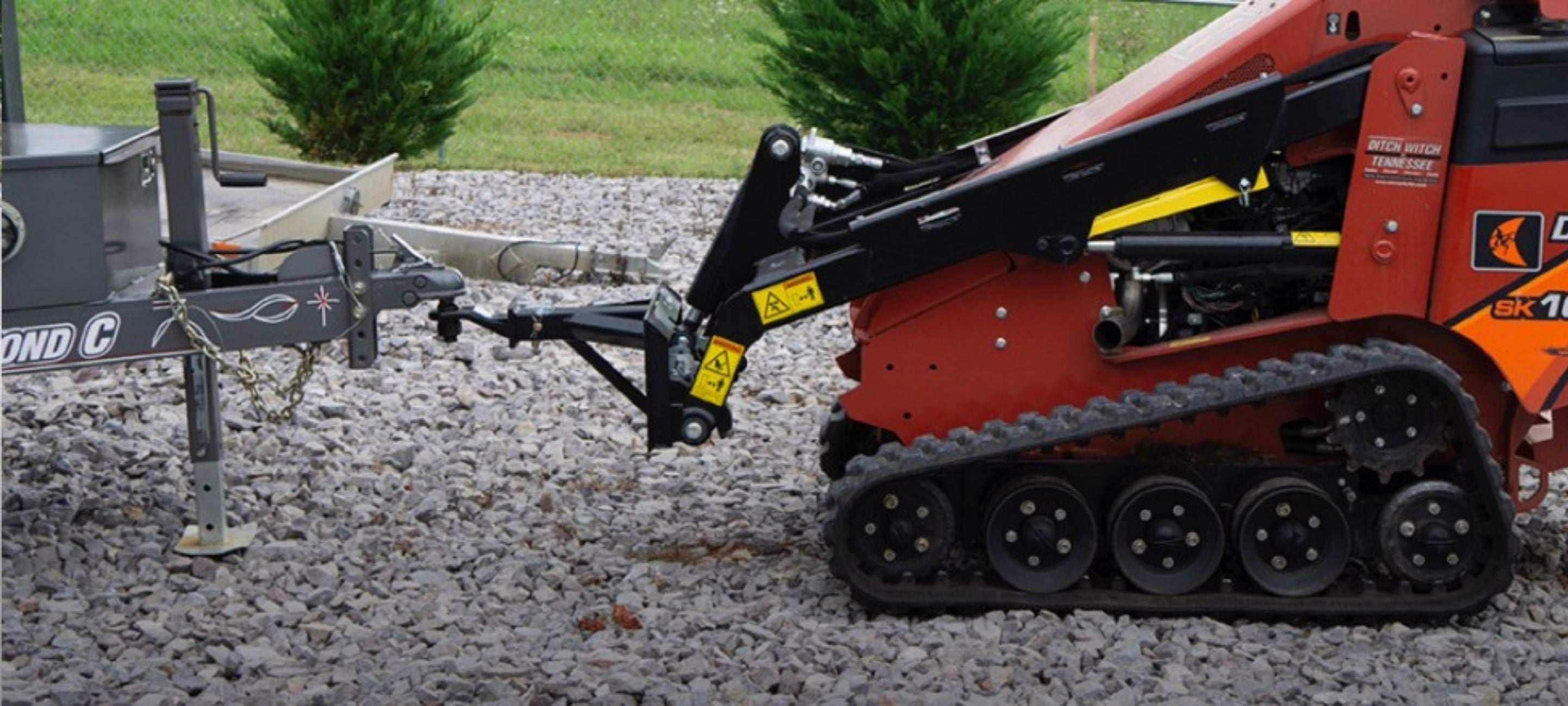 Ditch witch in action with the Blue diamond trailer mover attachment