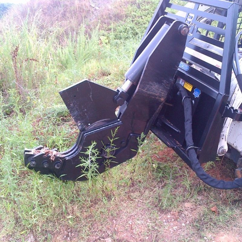 Bobcat skid steer with the tree shear attachment for sale