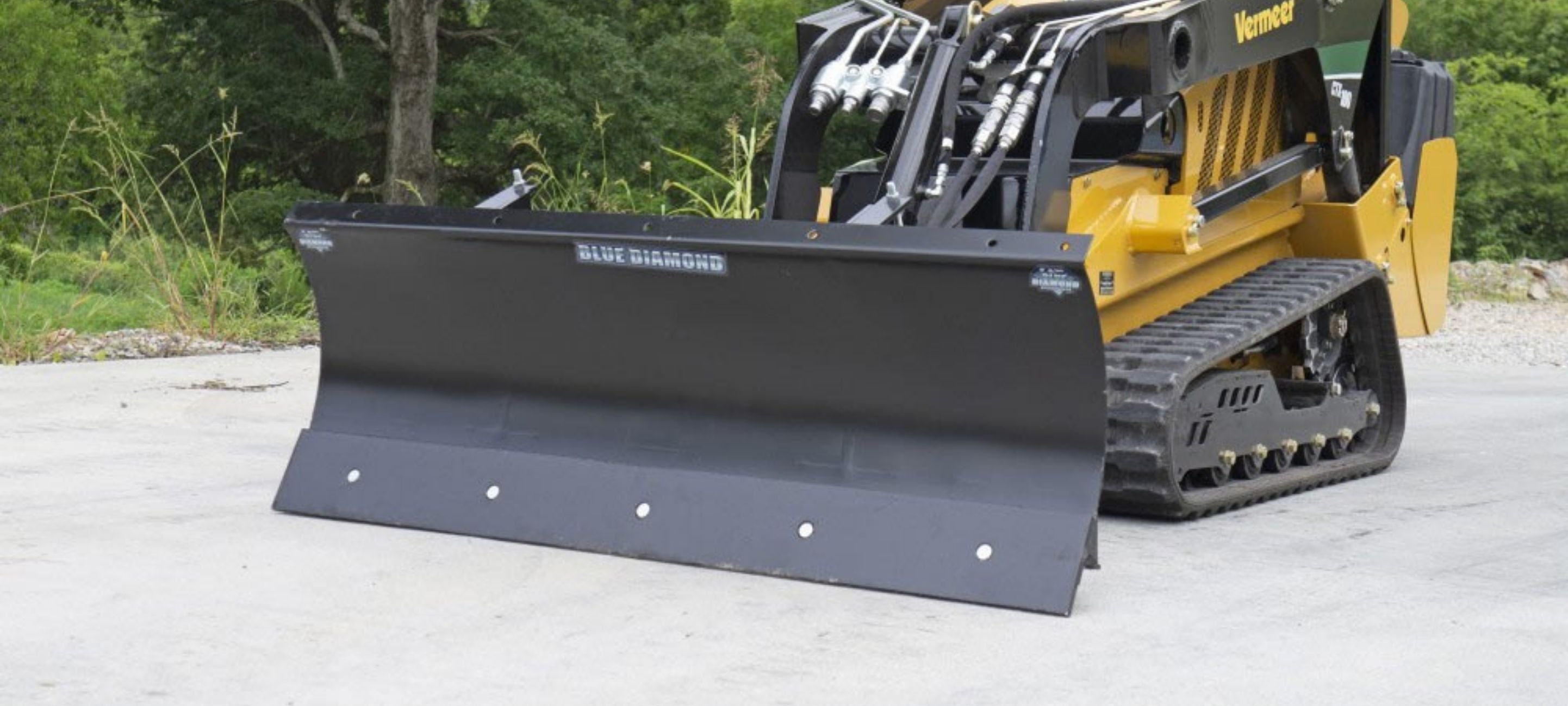 Vermeer with the mini skid steer snow blade attachment from Blue Diamond