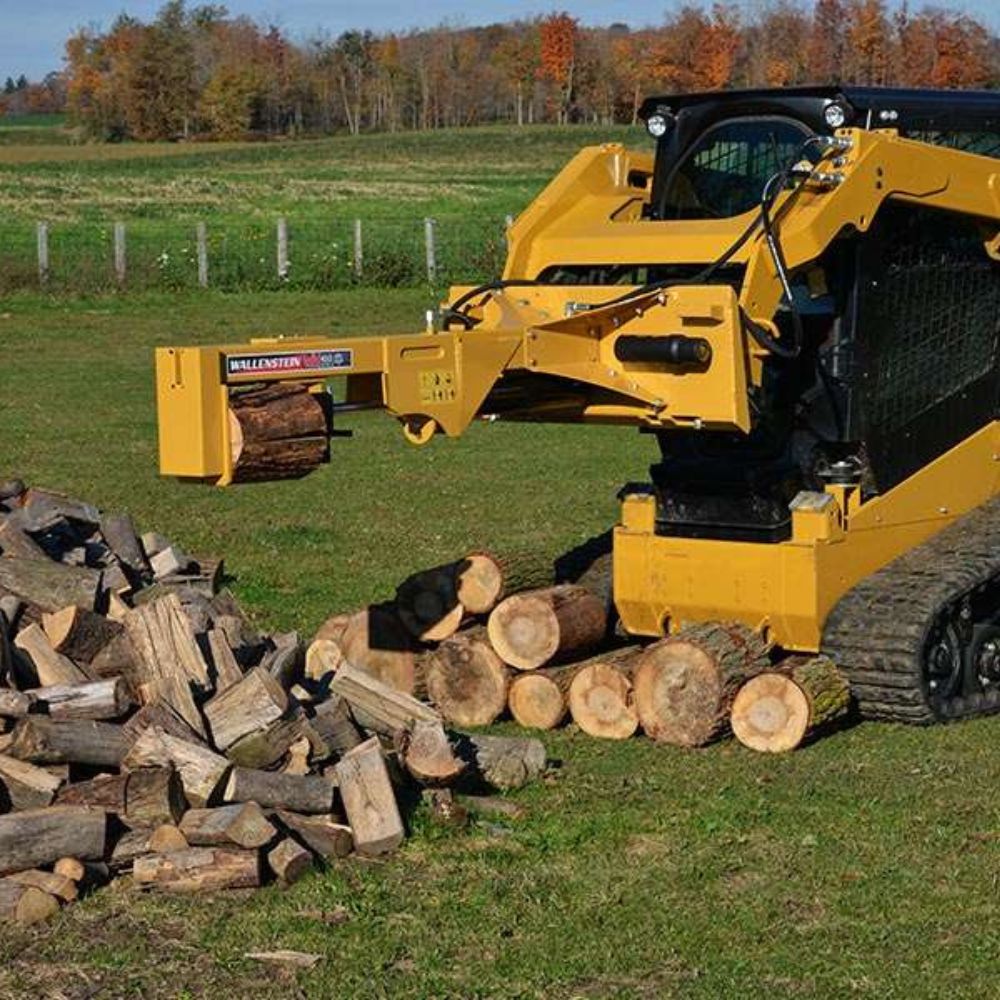 cat-skid-steer-chipping-woods-using-the-wallenstein-log-splitter-attachment