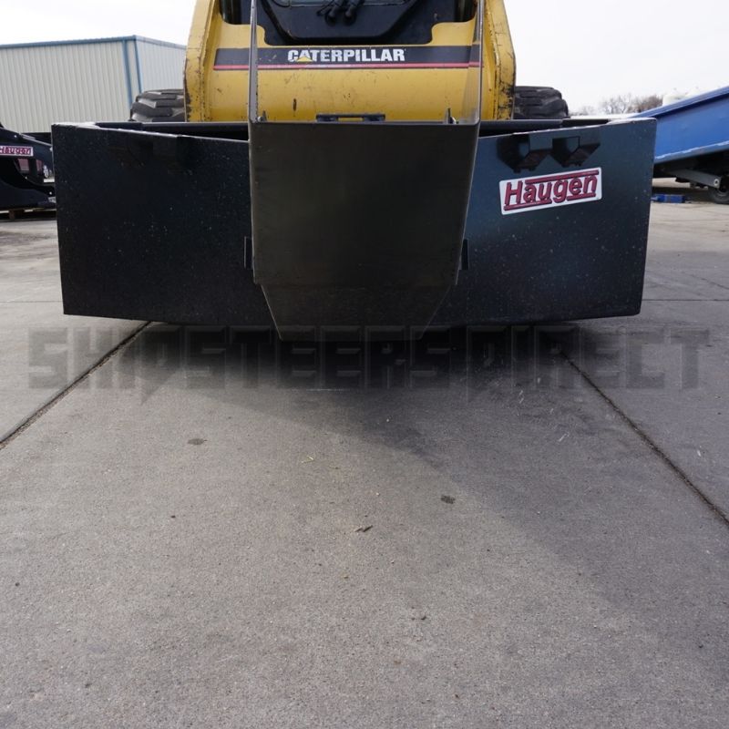 caterpillar-skid-steer-with-the-haugen-concrete-bucket-attachment