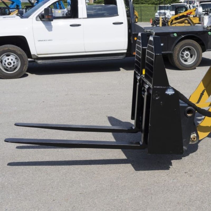 cat skid steer with the blue diamond 6,000 lbs capacity pallet fork