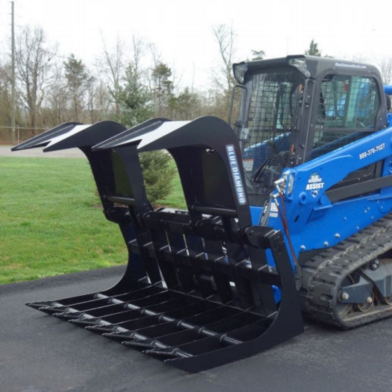 skid steer with the blue diamond extreme duty root grapple