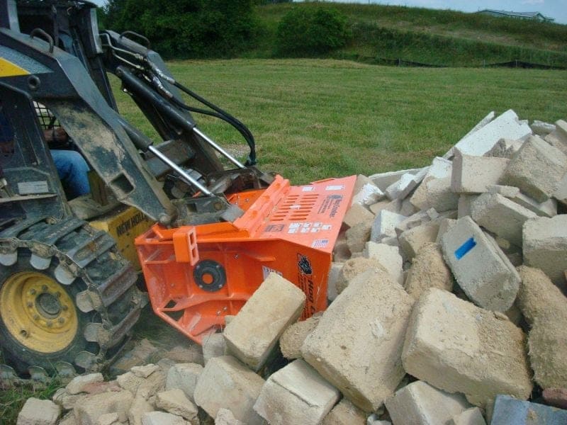 recycling concrete bricks with skid steer