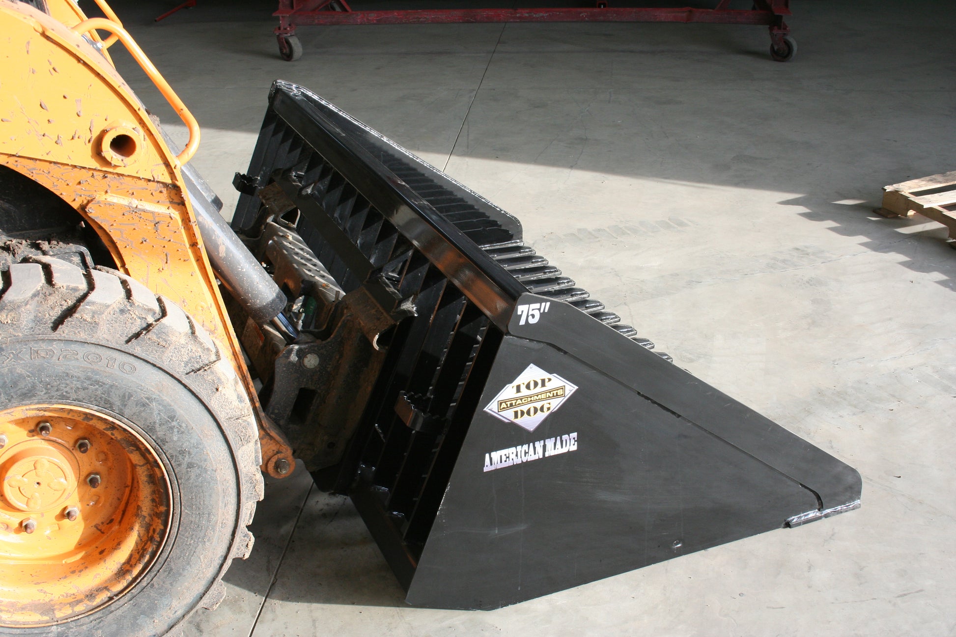 firewood-bucket-attachment-on-a-case-skid-steer-side-view