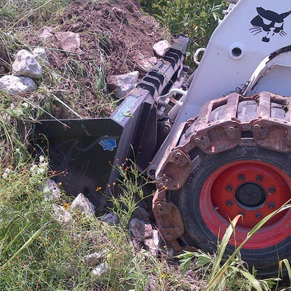 skid steer with blue diamond bucket attachment in the field