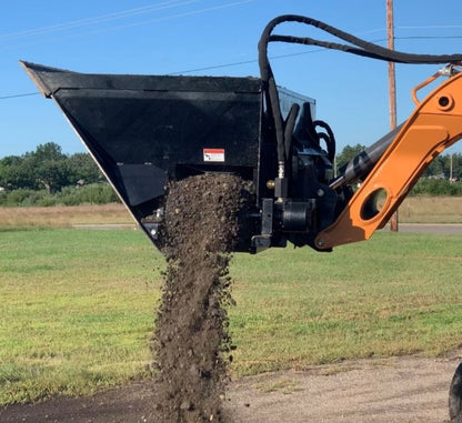 side dumping of the dual side flow bucket from top dog