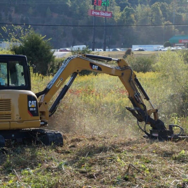 caterpillar excavator brush cutting