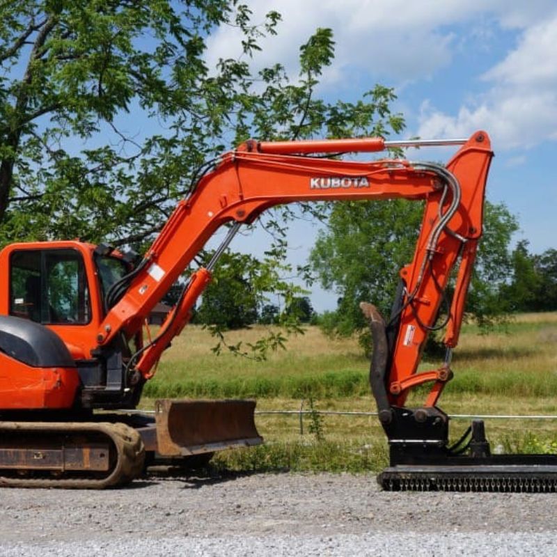 kubota mini excavator with the blue diamond brush cutter