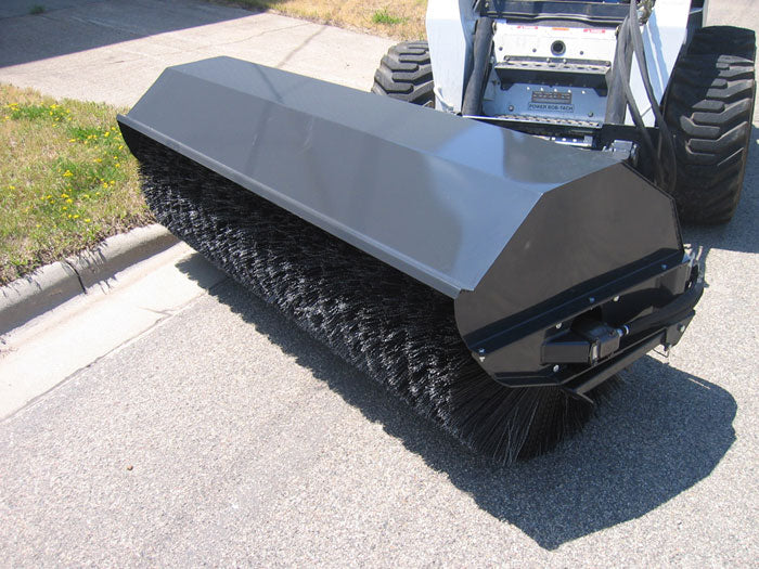Bobcat skid steer with a broom sweeper from haugen attachments