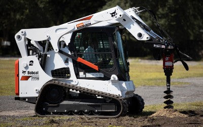 bobcat skid steer in action with the auger from mclaren