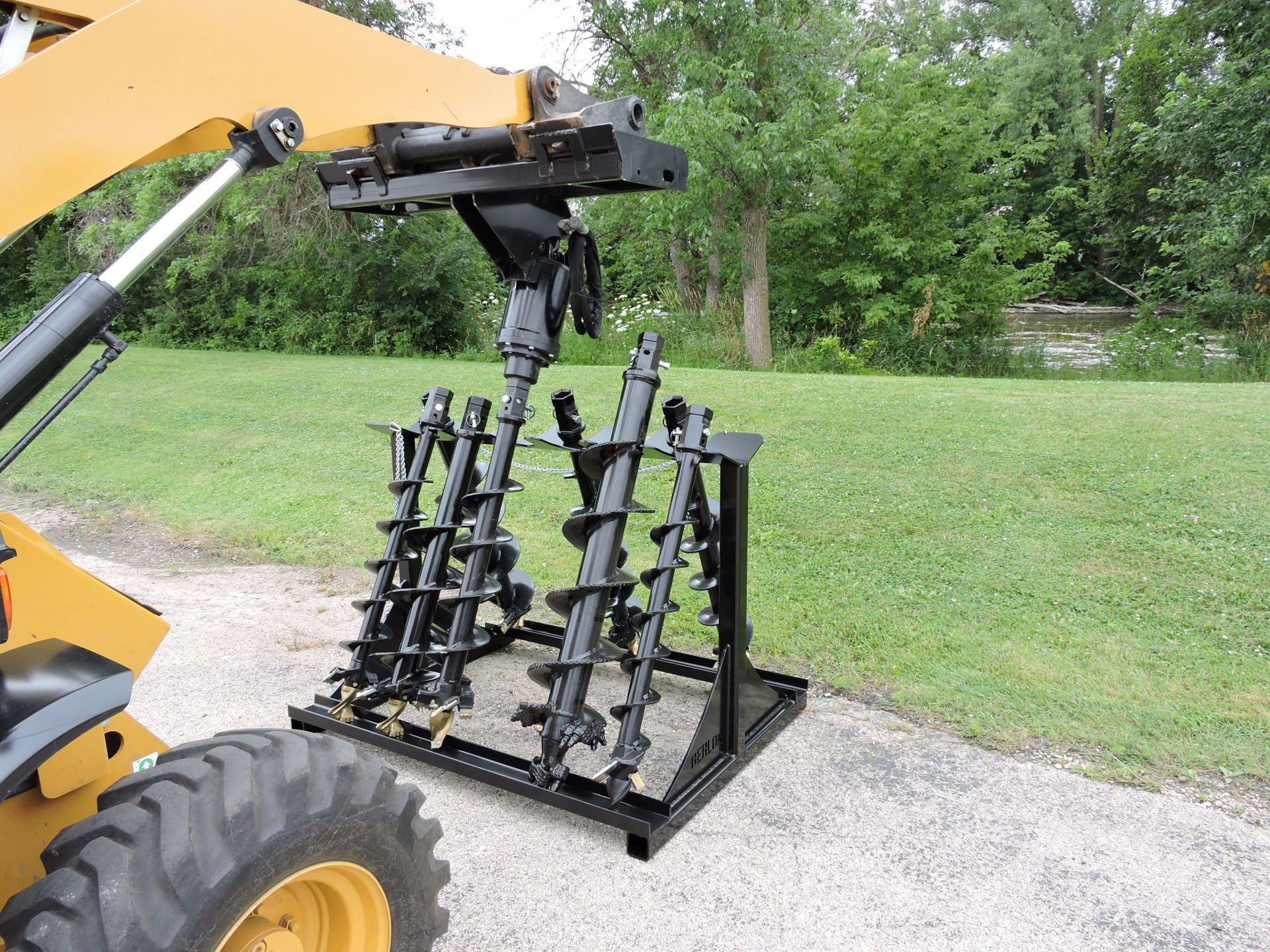 Skid loader deals post hole auger