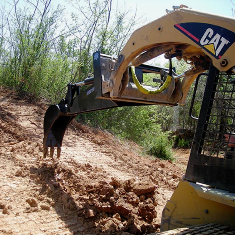 Cat Skid Steer with Blue Diamond Backhoe Attachment