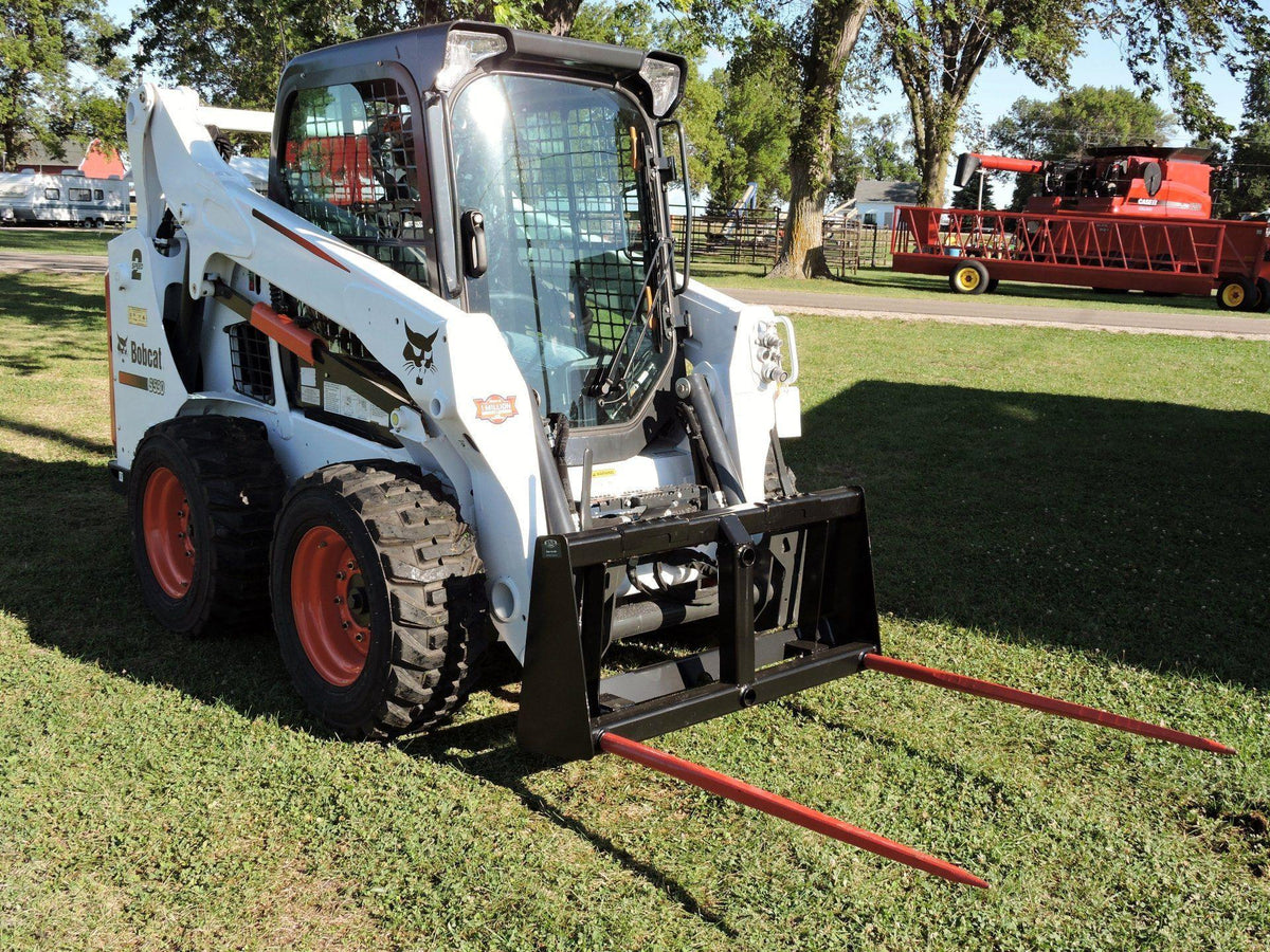 bobcat skid steer with the Bale Spear Carriages from Berlon Industries 