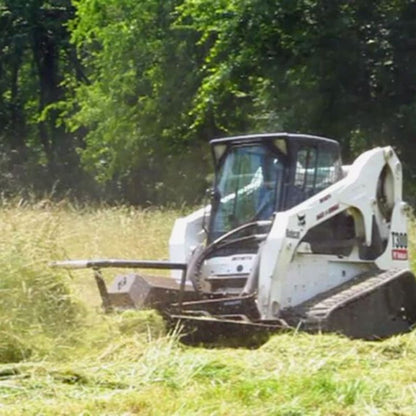 Bobcat mini skid steer in use with the Brush Cutter Extreme Duty Open Front by Blue Diamond