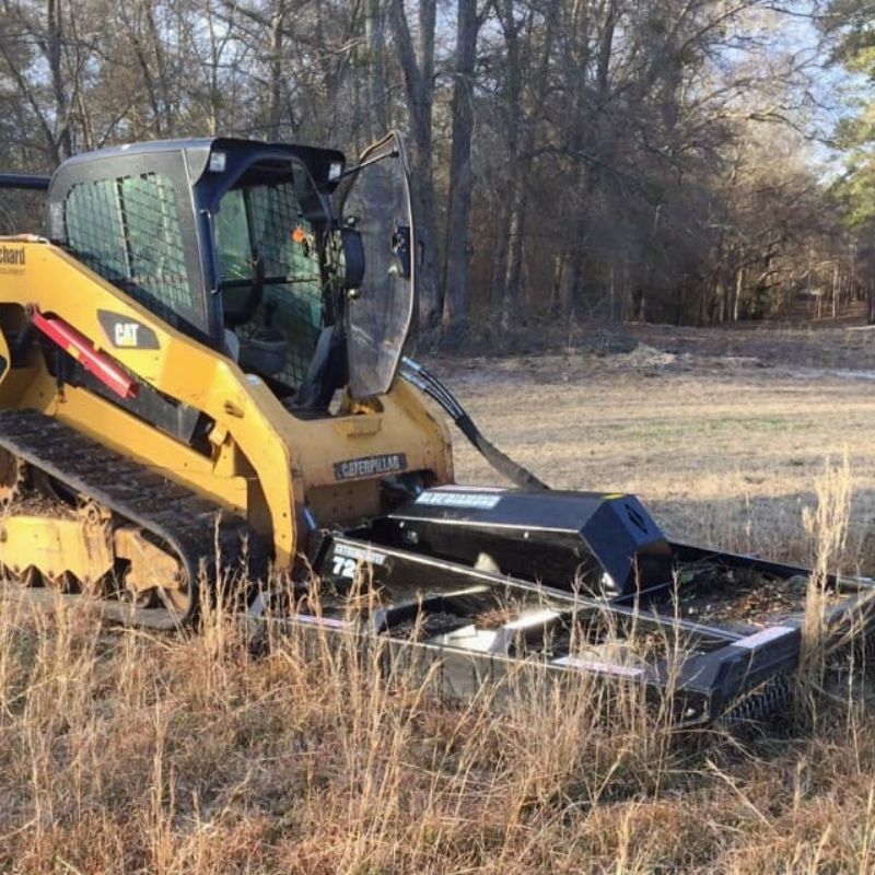 cat skid steer with the blue diamond brush cutter extreme duty