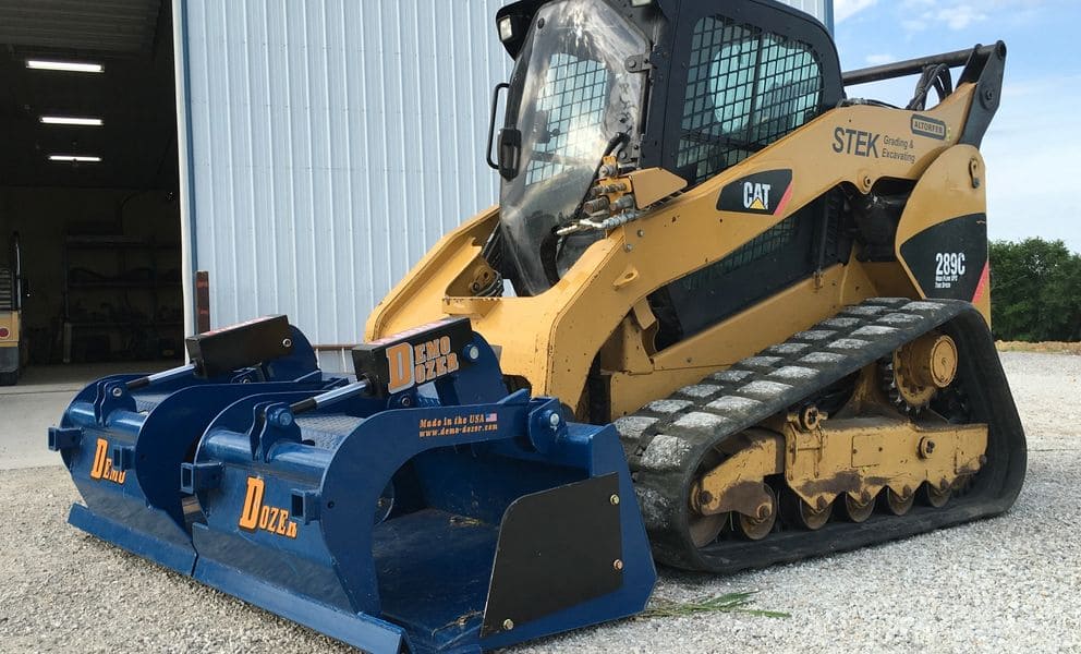 demo dozer grapple bucket on a cat skid steer ready to action