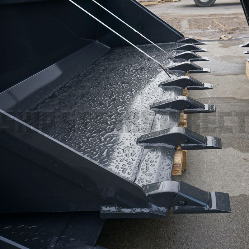 closer-view-of-the-dirt-bucket-teeth-on-the-ground