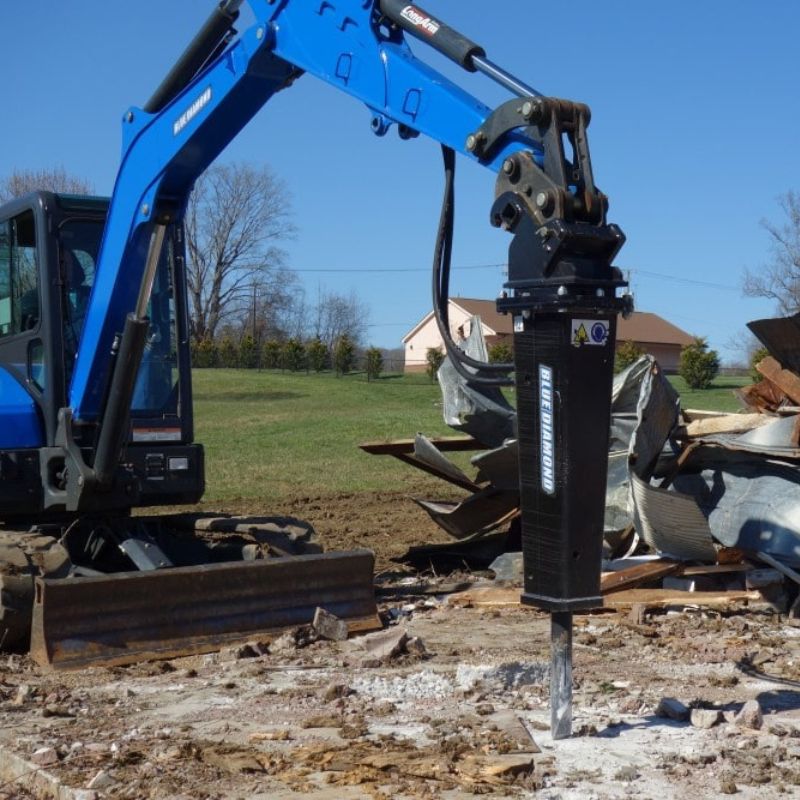 excavator with the blue diamond hydraulic hammer in action