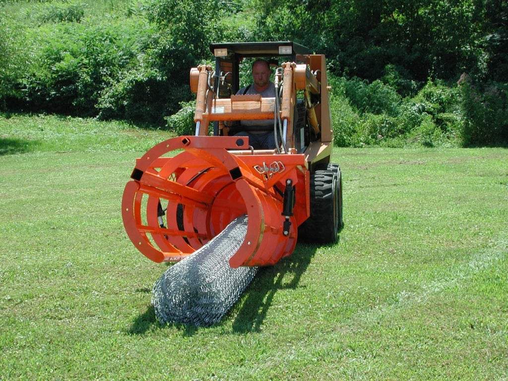 fence hog picking up roll of chain link fence