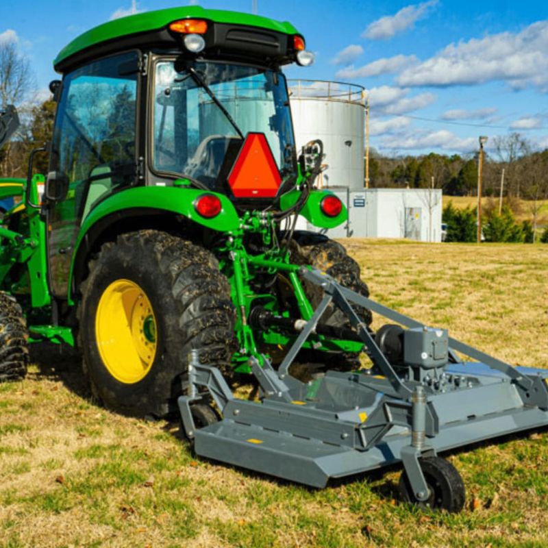 tractor with the blue diamond finishing mower attachment