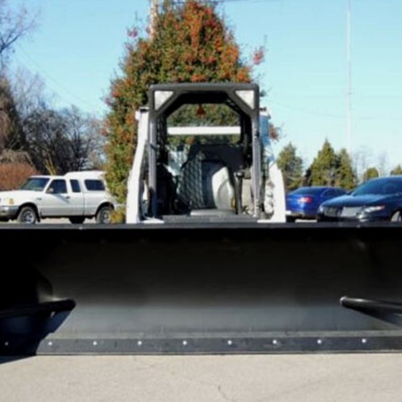 skid steer with blue diamond heavy duty snow pusher