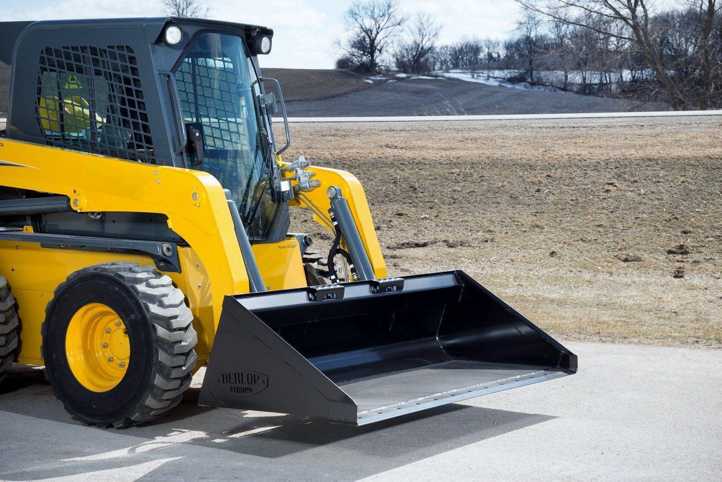 Cat Skid Steer with the Berlon's Heavy Duty Extended Lip Bucket