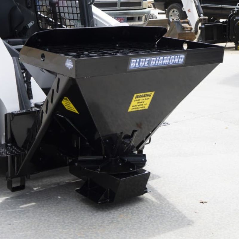 skid steer with the blue diamond hd material spreader