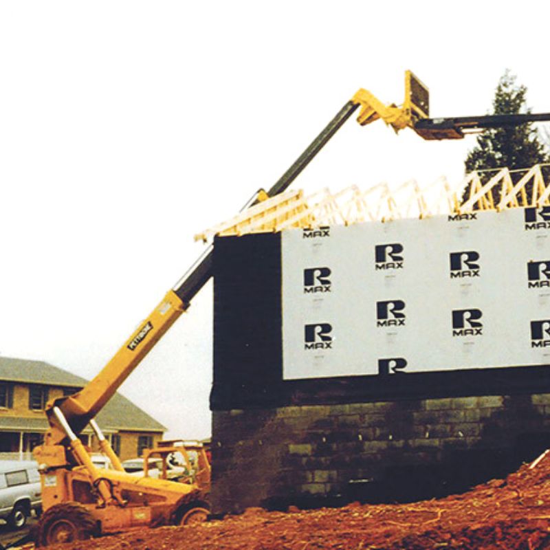 Telehandler with the job boom attachment in action. 