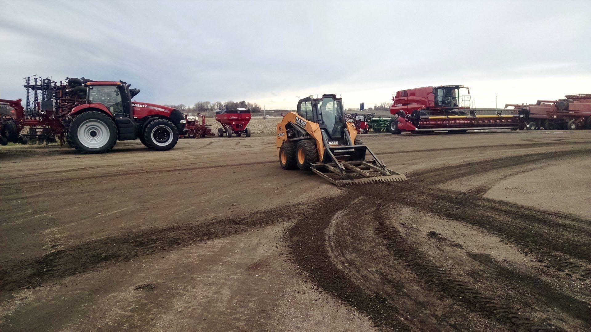 skid steer in action with the land plane from berlon industries