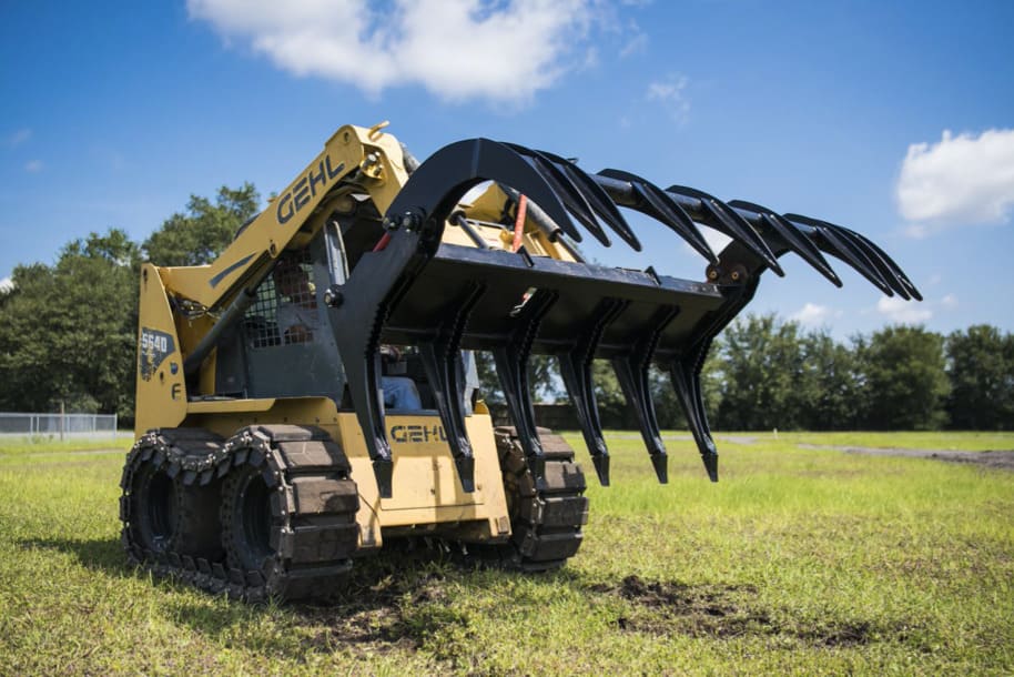 gehl skid steer ready to action with mclaren severe duty rake grapple