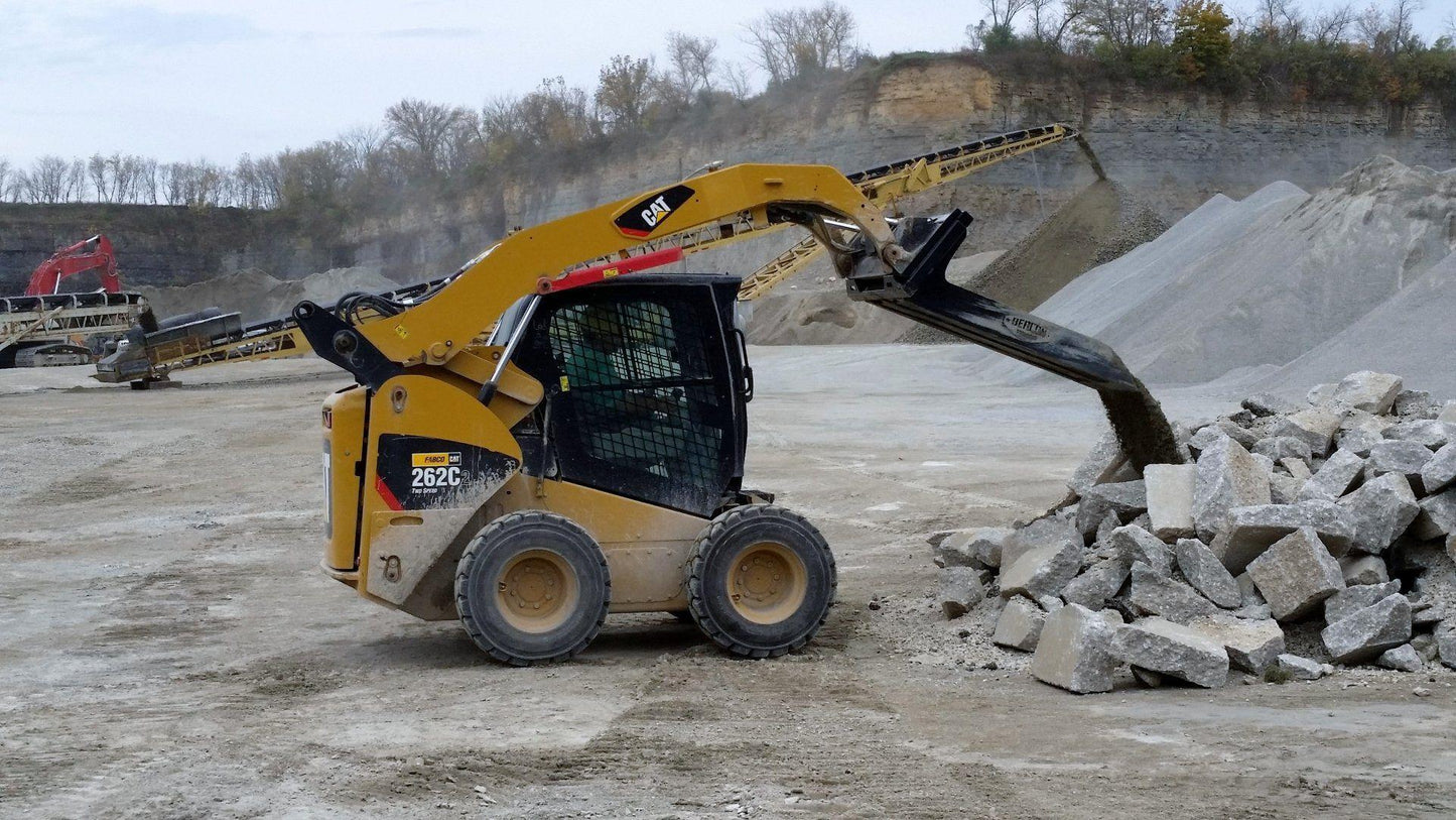 Cat Skid Steer with the Material Long Bucket Berlon Industries  in action