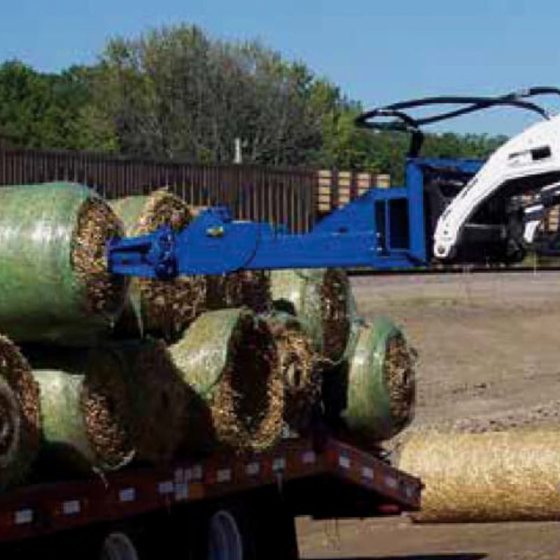 skid steer with blue diamond material roller