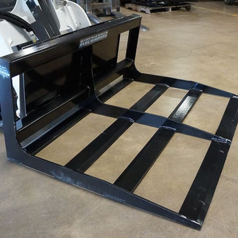 mini skid steer land planer attachment on the ground from blue diamond